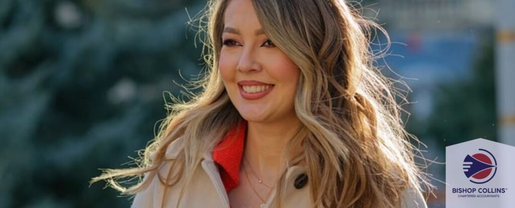 Corporate woman standing outdoors smiling